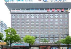 a building with hello kitty on top of it at City Comfort Inn Jingzhou Ancient City Taiyue Road in Caoshi
