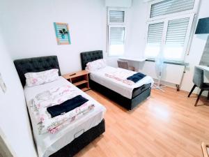 Postel nebo postele na pokoji v ubytování Apartment Haus