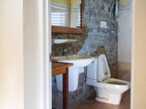 a bathroom with a sink and a toilet at Lei Thar Gone Guest House in Yenangyaung +39 photos