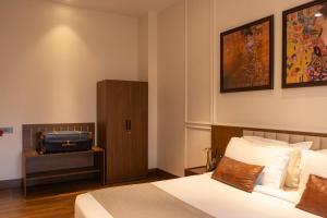 Postel nebo postele na pokoji v ubytování Park Suites