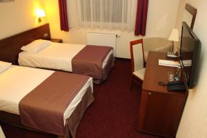 Posteľ alebo postele v izbe v ubytovaní Hotel Arena Expo