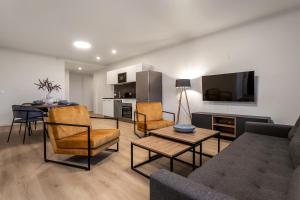 a living room with a couch and a table at EIR Apartments by Heimaleiga in Reykjavík