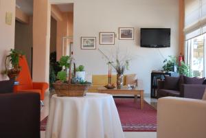 TV a/nebo společenská místnost v ubytování Hotel Achillion