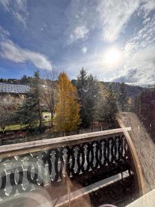 a view of a bridge with trees and the sky at L'appart du Yeti, cocon rénové avec goût, multipass été, ménage et linges compris in Les Gets