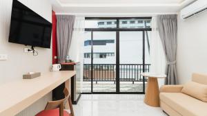 Μια τηλεόραση ή/και κέντρο ψυχαγωγίας στο Laoteng Boutique Hotel +40 φωτογραφίες