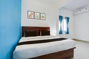 En eller flere senge i et værelse på Hotel O by OYO Ranchi Retreat