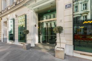 a store front of a building with glass windows at FortyPlusOne Hotel Vienna in Vienna