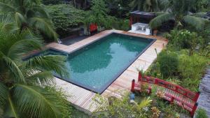 an overhead view of a swimming pool on a wooden deck at Molmol Cafe in Larena