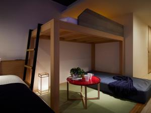 Ένα ή περισσότερα κρεβάτια σε δωμάτιο στο Minn Shin-Osaka