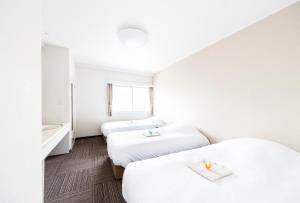 Postel nebo postele na pokoji v ubytování Best Hotel