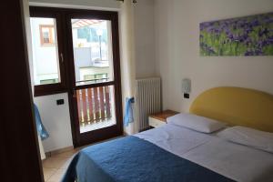 Postel nebo postele na pokoji v ubytování Lanterna Apartment 1