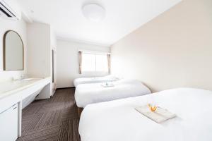 Postel nebo postele na pokoji v ubytování Best Hotel