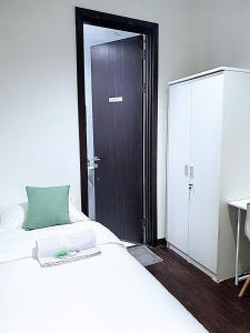 Postel nebo postele na pokoji v ubytování The Breakout Room ICE BSD