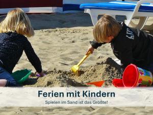 two children playing in the sand on the beach at Heringsdorf, Ferienwohnung Hanni in Heringsdorf