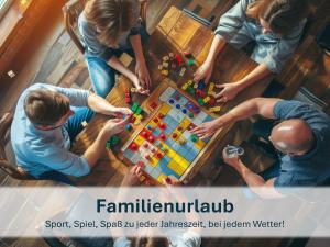 a group of people playing a board game on a table at Heringsdorf, Ferienwohnung Hanni in Heringsdorf +17 photos