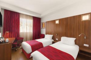 Katil atau katil-katil dalam bilik di Ramada Encore By Wyndham Tangier