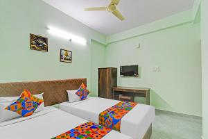 Postelja oz. postelje v sobi nastanitve FabHotel Legacy