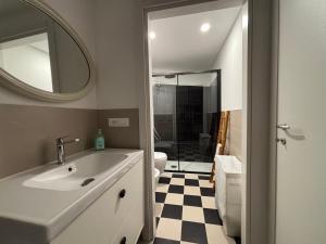 a bathroom with a sink and a mirror at Cà du Local in Arenzano