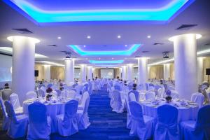 a banquet hall with white tables and chairs at Hotel Antofagasta in Antofagasta +92 photos