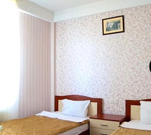 En eller flere senge i et værelse på ATFKotel