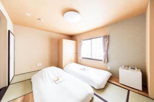 Postel nebo postele na pokoji v ubytování Best Hotel