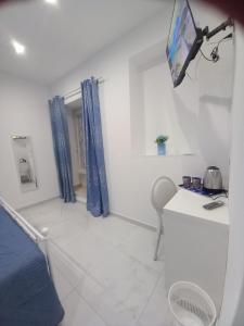 TV a/nebo společenská místnost v ubytování MaMmaRosa Ortigia, historic city of Syracuse