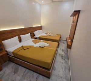 Postel nebo postele na pokoji v ubytování Hotel Ponrayar