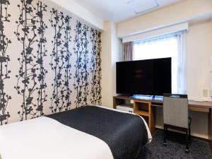 TV a/nebo společenská místnost v ubytování APA Hotel Osaka Kadomashi Ekimae