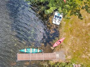 an overhead view of a boat and a dock next to a river at Lakefront Big Bass Lake Dock Games in Gouldsboro