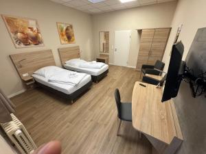 Una televisión o centro de entretenimiento en Boardinghaus-net