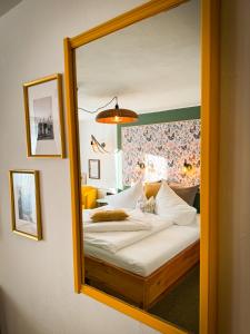 Postel nebo postele na pokoji v ubytování Hotel Tenne