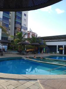 Swimmingpoolen hos eller tæt på Apartamento 1 quarto para 5 pessoas + 4 billeder