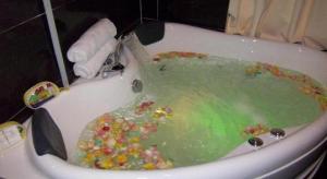 a bath tub filled with lots of candy at Paragon City Hotel in Kampong Simee +123 photos