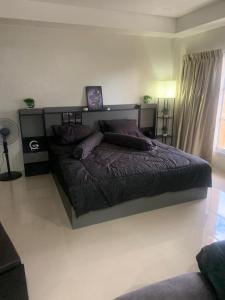 En eller flere senge i et værelse på JRJ Residence