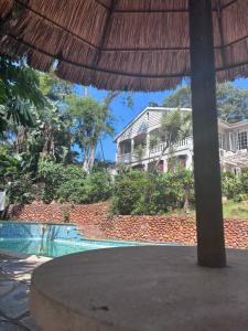 a resort with a swimming pool and a building at The Easy Stay in Durban