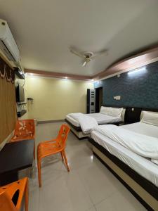 Giường trong phòng chung tại Hotel Lisa Galaxy