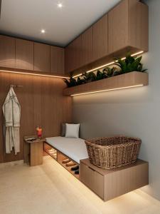 a room with a bed and a bench and a table at Citadines Almaz Aparthotel Casablanca in Casablanca