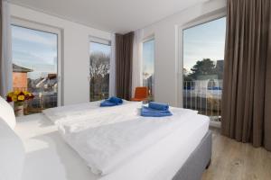 Postel nebo postele na pokoji v ubytování Haus KLIPPER Norderney