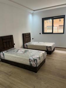 Giường trong phòng chung tại Duplex Menara Garden 2