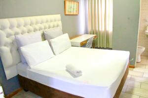 Postel nebo postele na pokoji v ubytování Zabalaza Guesthouse + 36 fotografií