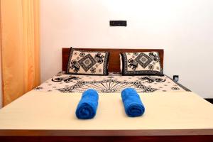 Postel nebo postele na pokoji v ubytování Royal Residence Negombo