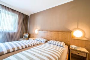 Postel nebo postele na pokoji v ubytování Pension Astoria