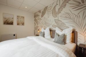 En eller flere senge i et værelse på HYGGE HOMES Apartment 'Lykke Loft'