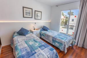 En eller flere senge i et værelse på Villa Playa Esperanza by Rentallorca + 27 billeder