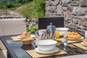 a table with food and eggs on it at 1 Bed in Nantygwreiddyn oc-bow49 in Sennybridge +13 photos