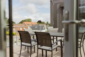 En balkon eller terrasse på HYGGE HOMES Apartment 'Lykke Loft'