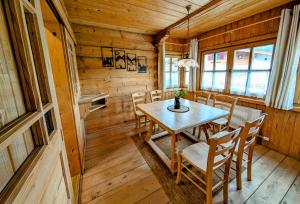 a dining room with a table and chairs at Haus Dirol in Kirchberg in Tirol
