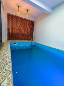 a room with a blue counter and a wall at Friendz Villa in Igatpuri