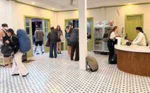 a group of people standing in a lobby at White Elephant Hostel in Luang Prabang +39 photos