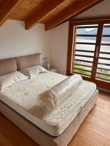 Postel nebo postele na pokoji v ubytování Gardenia stunning lake view